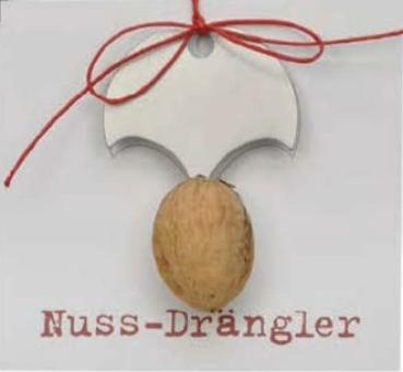 Nussdrängler aus Edelstahl mit einer Nuss und rotem Band