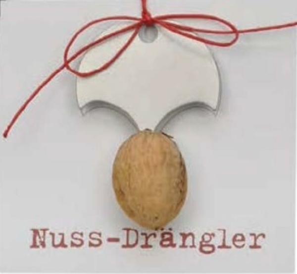Nussdrängler aus Edelstahl mit einer Nuss und rotem Band