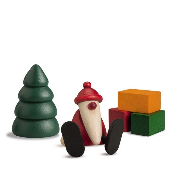 Miniaturset 1 | Weihnachtsmann auf Kante sitzend mit Baum und Geschenken